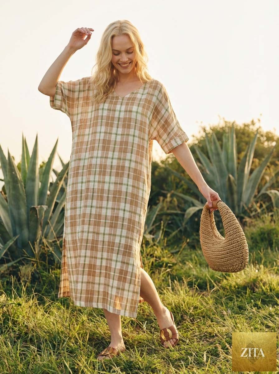 Round crochet woven straw tote bag by LINTICO with a handheld design, featuring a natural woven straw texture and round shape.