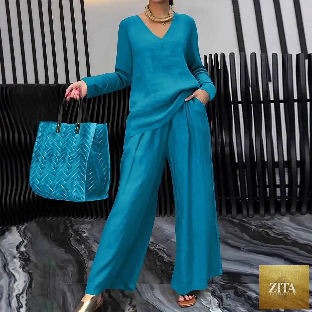 FitiqueFit solid color long sleeve top and pants two-piece travel set, casual and comfortable clothing for travel or lounging.