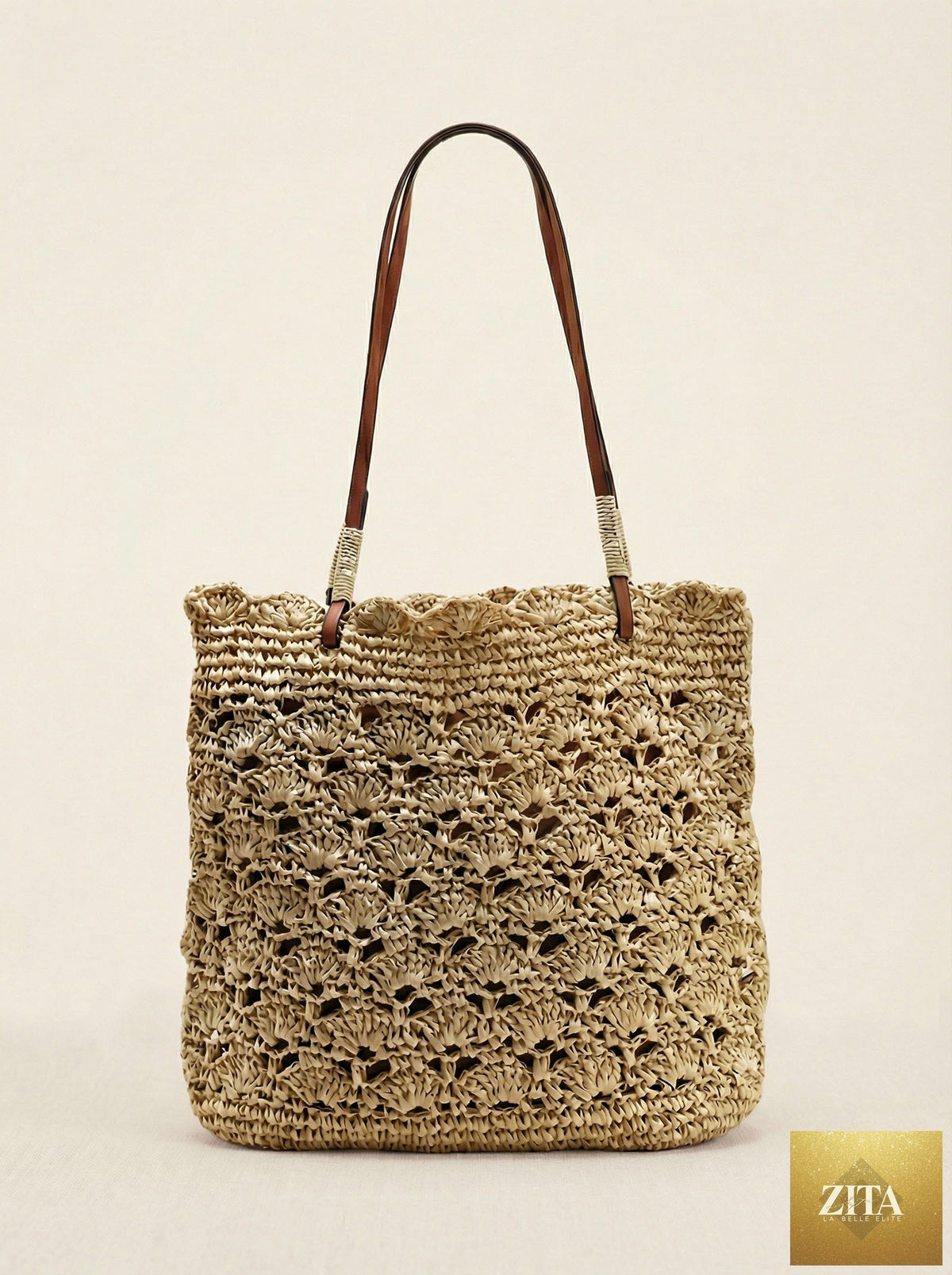 Crochet woven fan-shape shoulder tote bag by LINTICO with beige and brown tones, featuring a spacious design and woven texture.