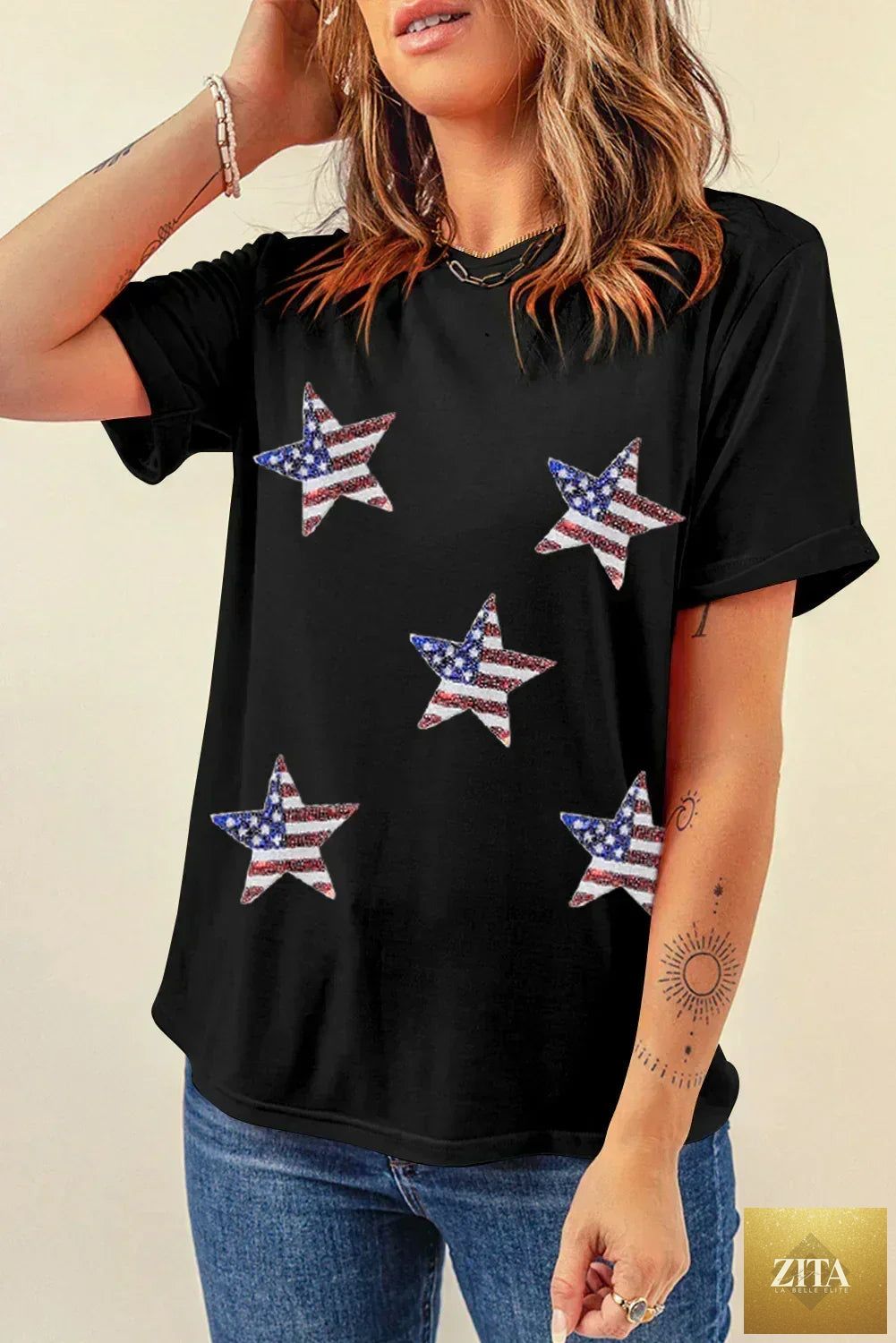 Black sequined American flag star graphic T-shirt by Femstylo featuring a bold star and flag design on soft fabric.