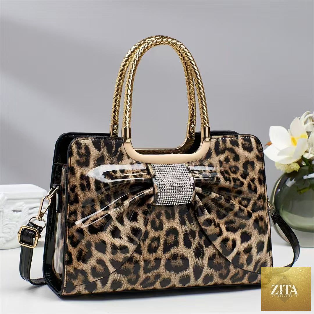 Elegant genuine leather handbag with leopard print and hot-stone embellishments, versatile and fashionable for women.