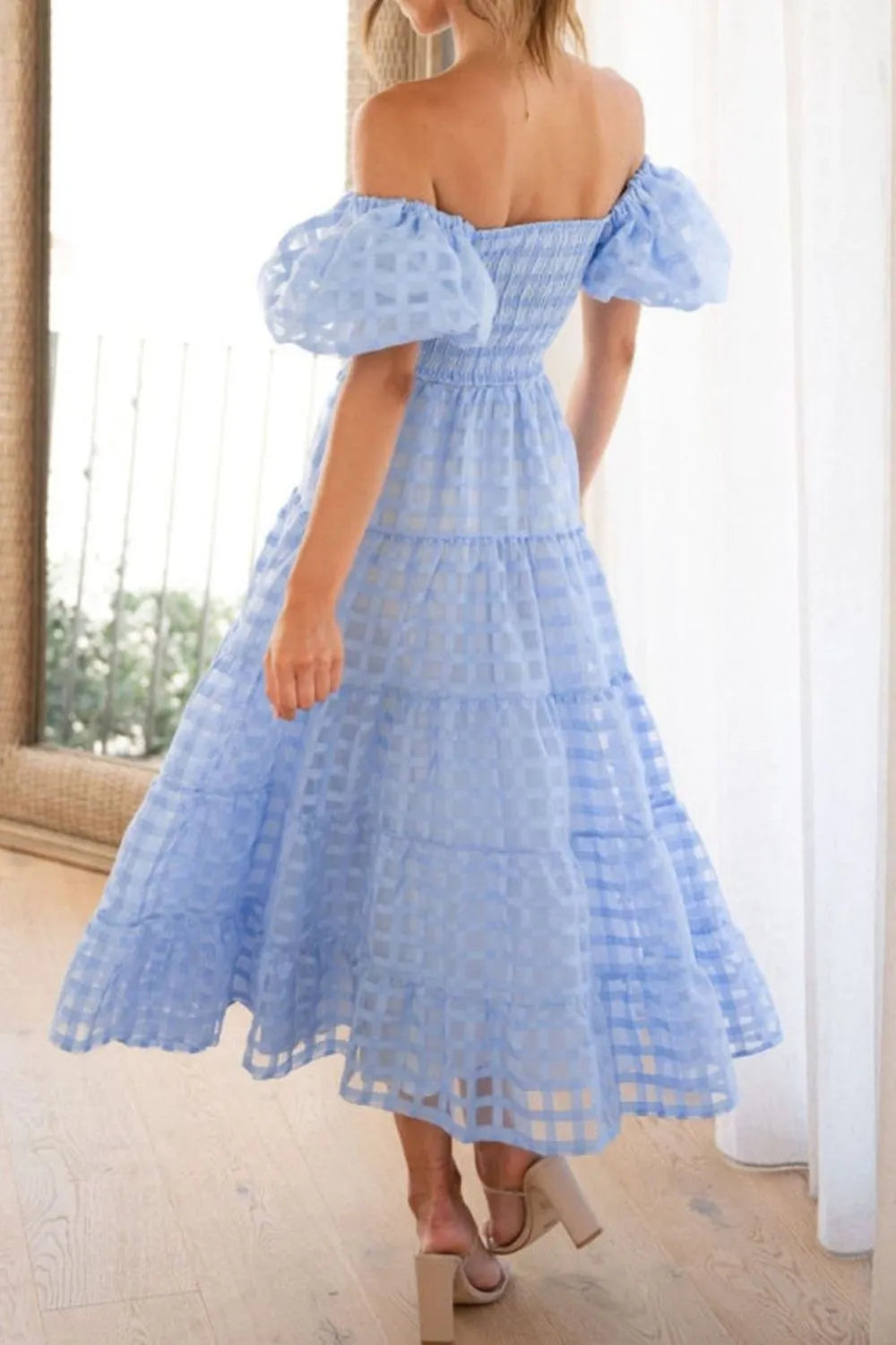 Off shoulder short puff sleeve midi dress by Shopiebay, featuring a feminine design with flowy fabric and elegant silhouette.
