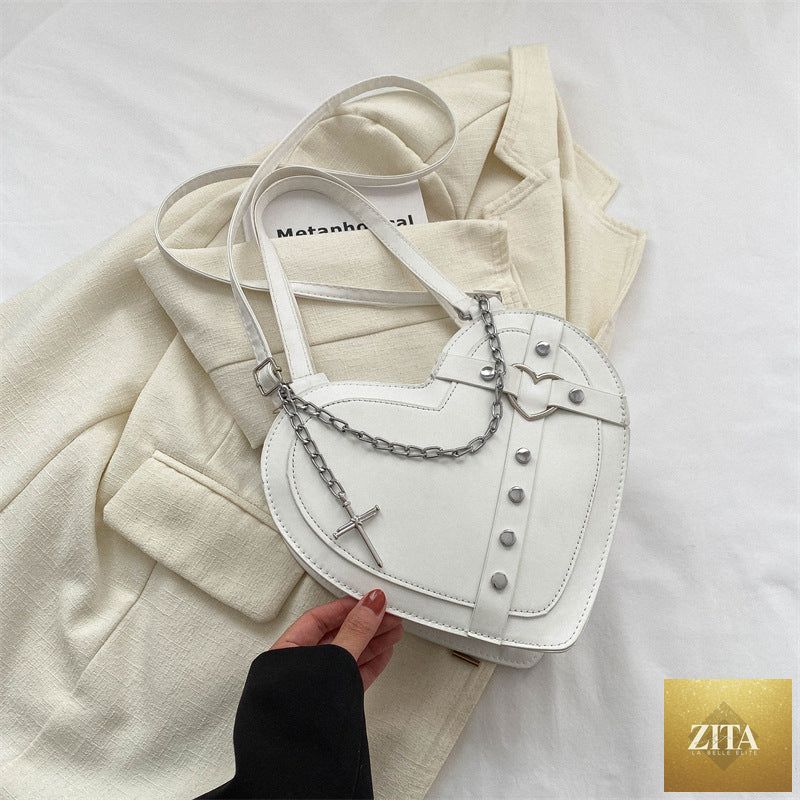 Korean-style cute heart-shaped shoulder crossbody bag from Social Buzz eSIMs with a compact design and adjustable strap.
