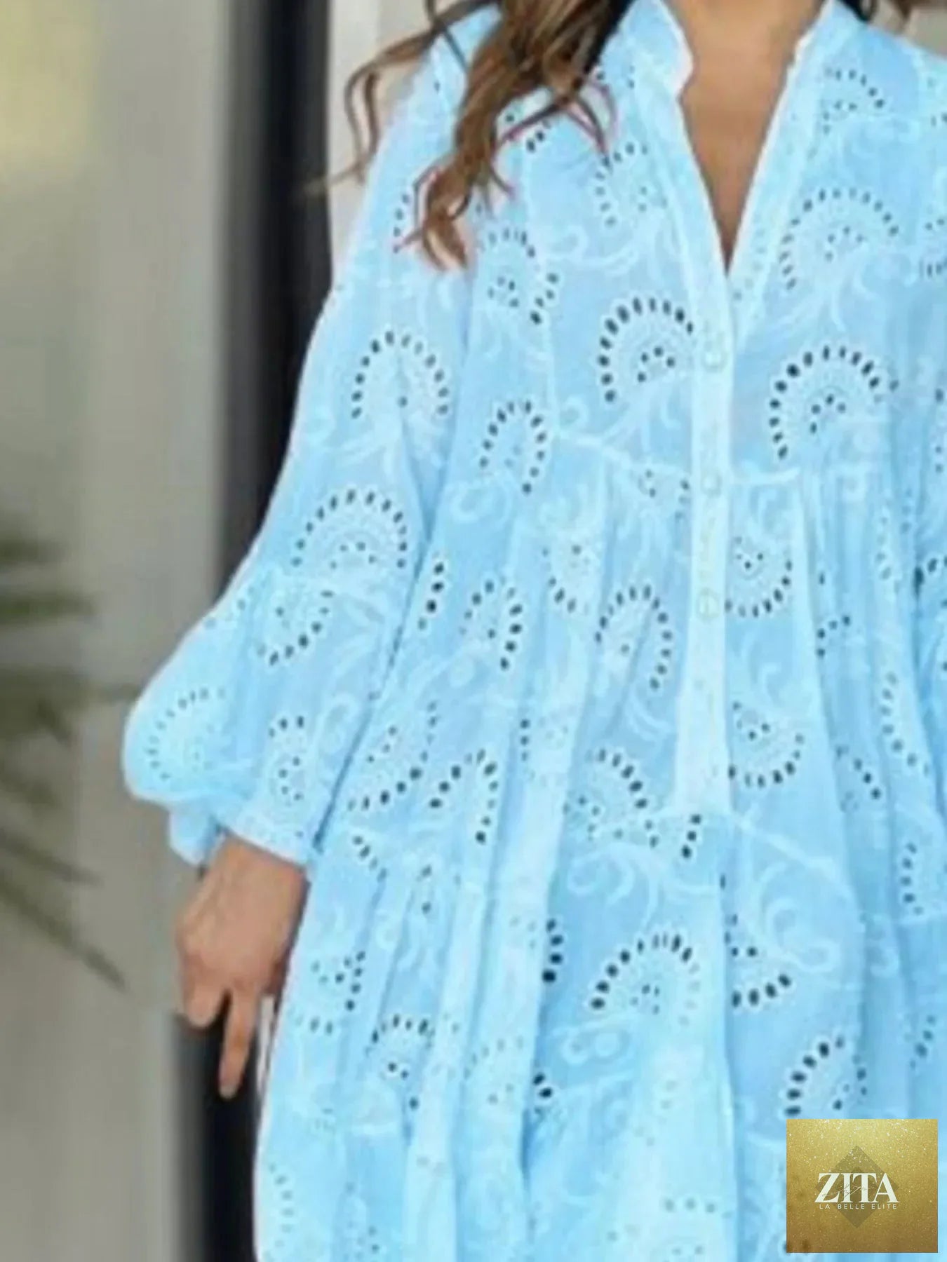Eyelet ruffled hem tiered dress by Shopiebay featuring a flowy, layered design with eyelet details and a ruffled hem.