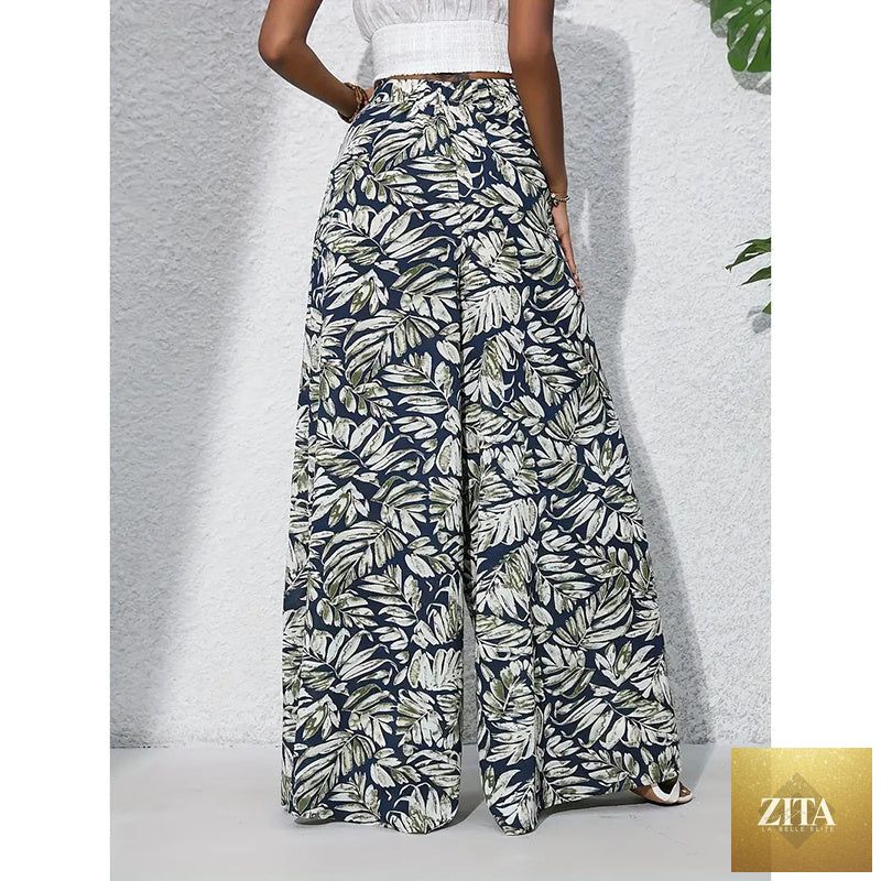 Women’s printed high-waist wide-leg palazzo pants by FitiqueFit, casualwear with bold floral pattern and flowy fit.