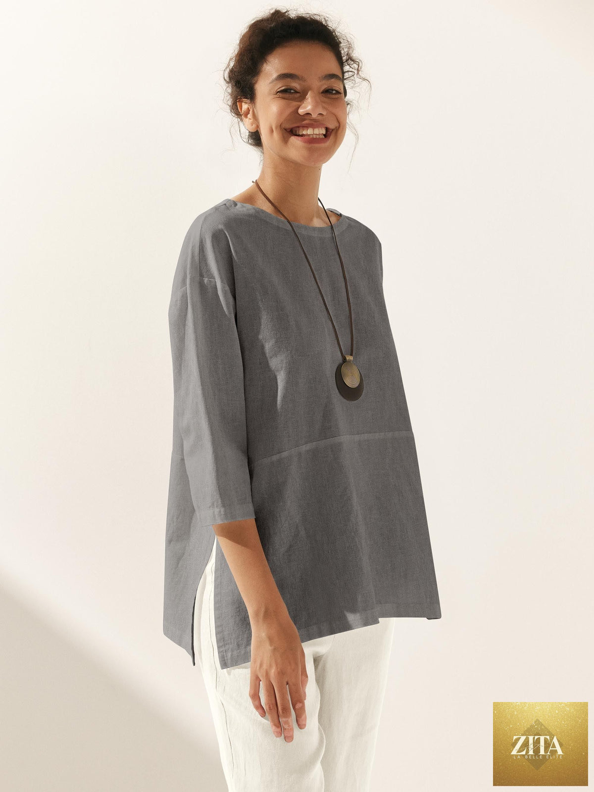 White linen blend boat neck oversized blouse by LINTICO, featuring a relaxed fit and casual style.