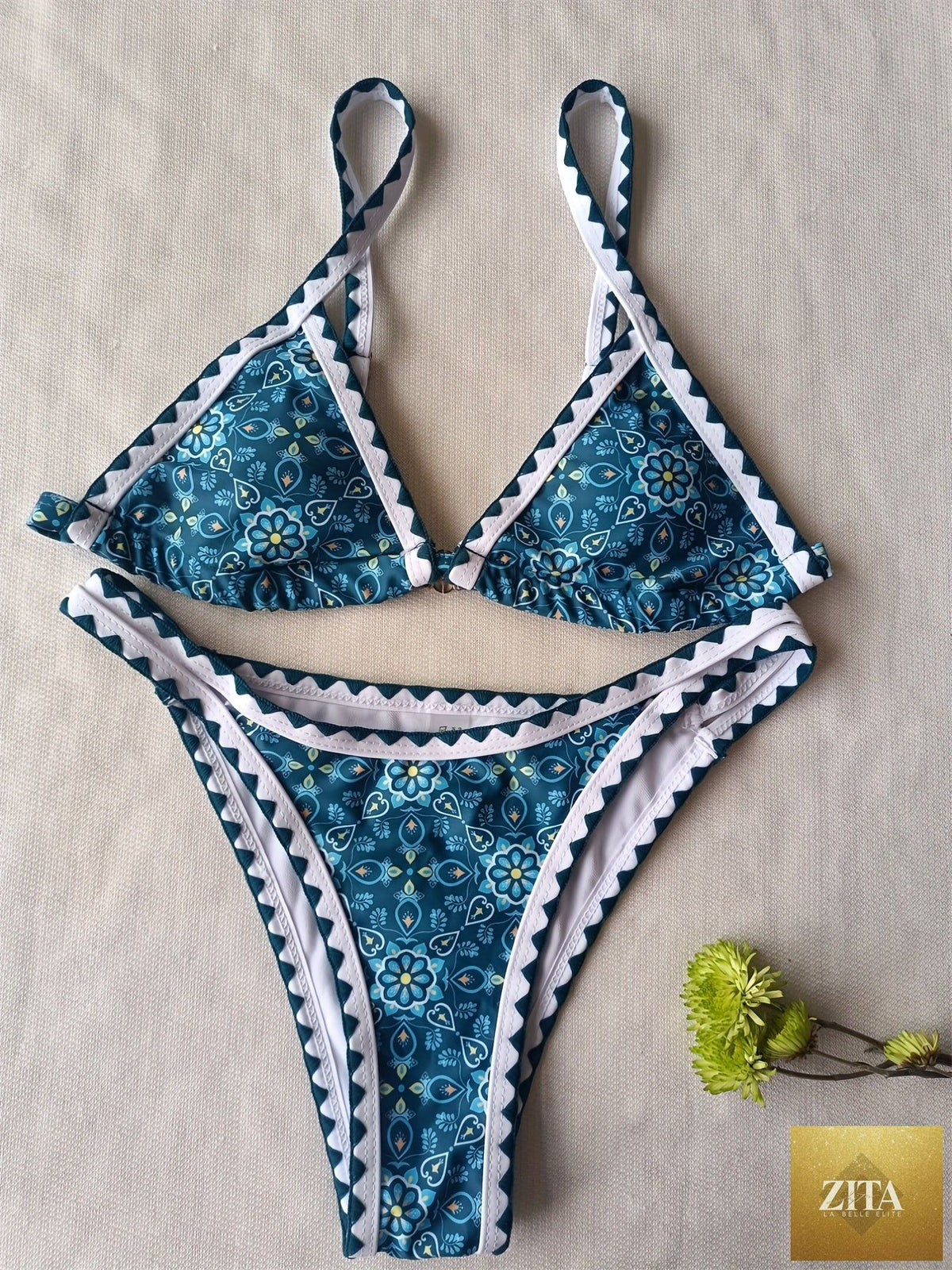 Stevvex floral print high-cut bikini set with embroidered cut-out triangular top, contrast trim, and back buckle for summer beachwear.