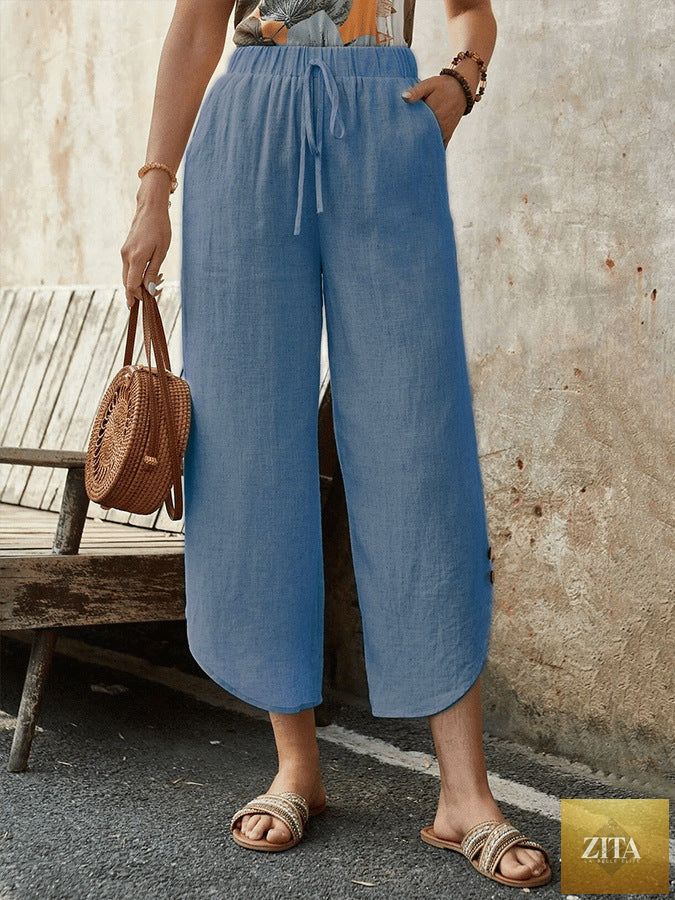 Women's cotton-linen cropped drawstring pants by FitiqueFit, casualwear with relaxed fit and adjustable waist, shown on model.