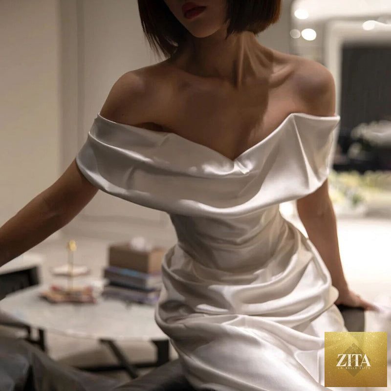 Elegant French White off-shoulder wedding dress for women, featuring a light, flowing design and romantic style.