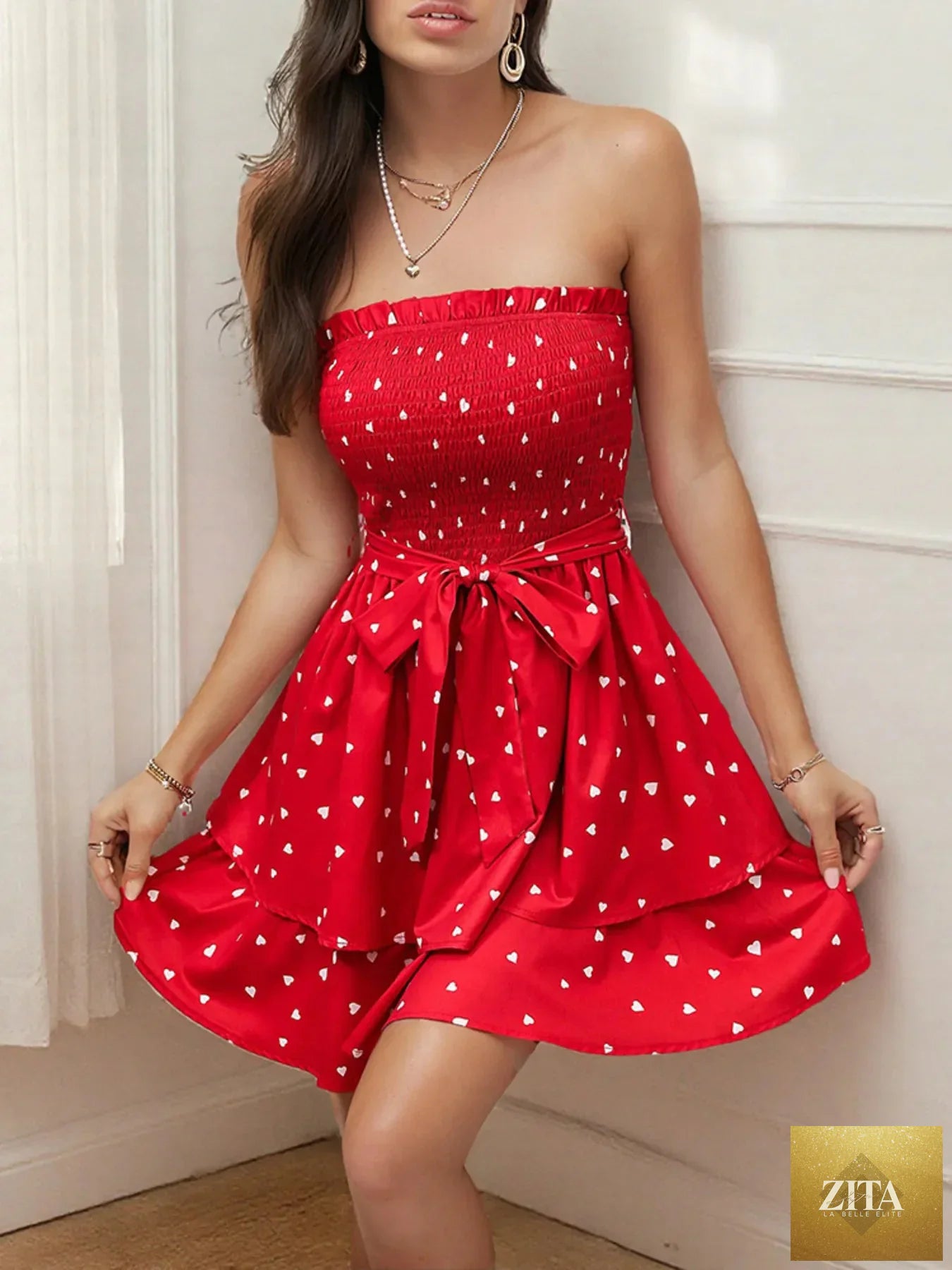 Smocked heart print tube dress by Shopiebay featuring a fitted silhouette and sleeveless design with playful heart patterns.