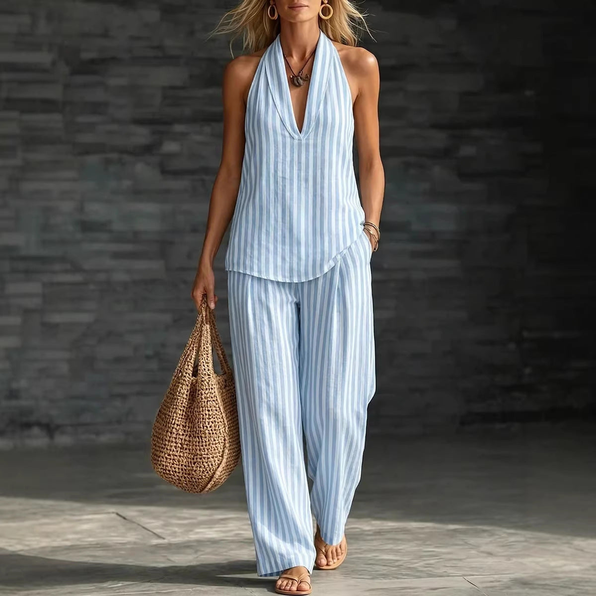 Women's striped sleeveless top and wide-leg pants set by FitiqueFit, casualwear with a stylish, relaxed fit and bold stripe pattern.