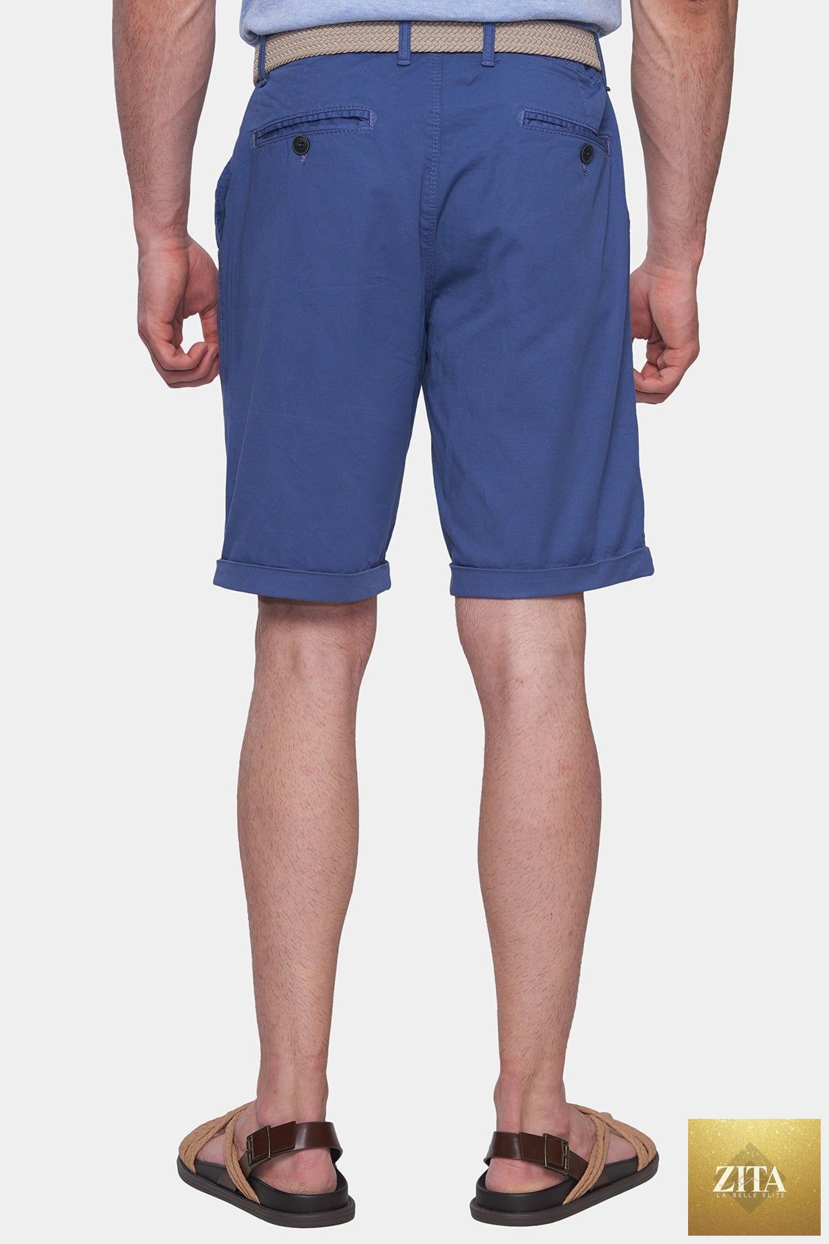 Oily blue summer shorts by Bright Moons with a casual fit, displayed on a hanger against a neutral background.