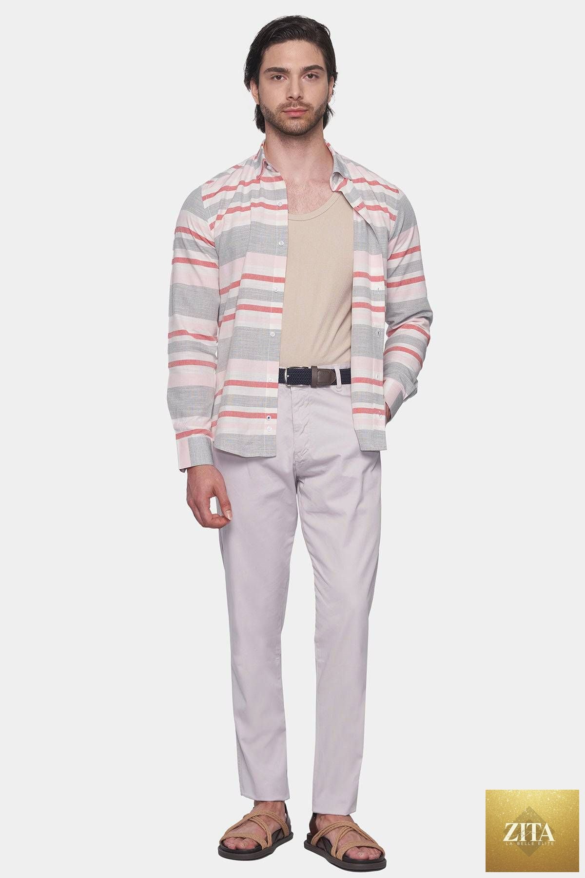 Off-white Bright Moons Timeless Chino pants displayed on a hanger with a focus on fabric texture and fit.