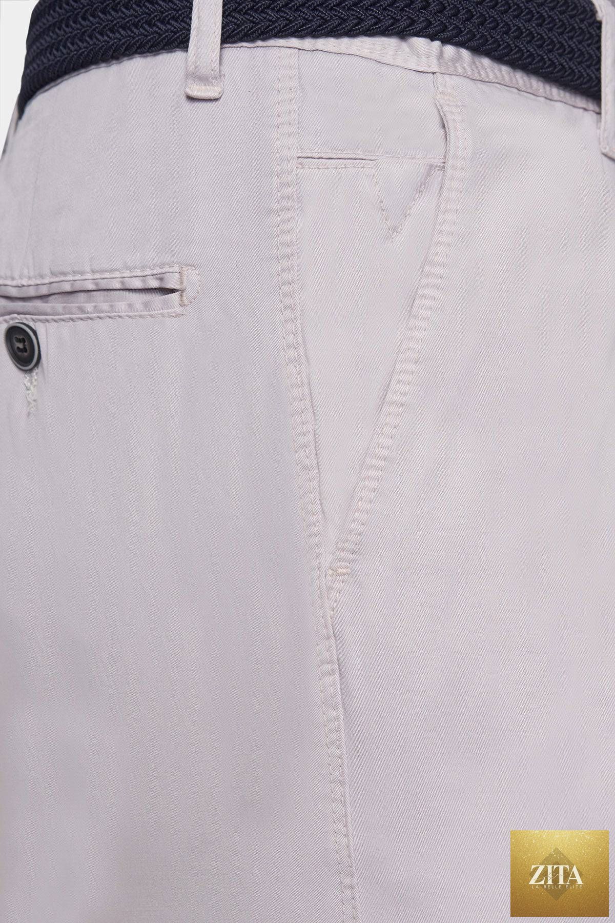 Off-white Bright Moons Timeless Chino pants displayed flat, showcasing the classic fit and fabric texture.