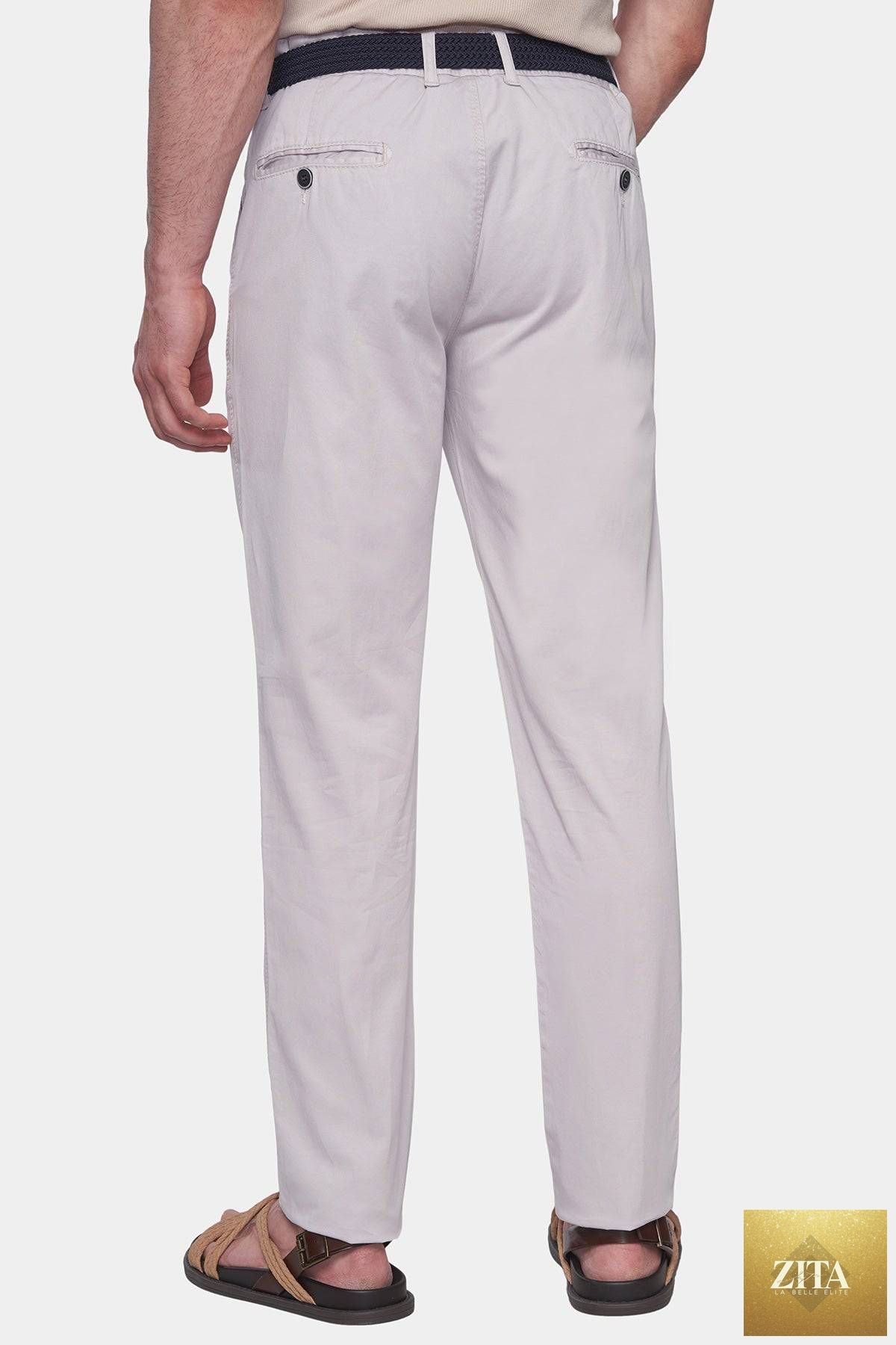 Off-white Bright Moons Timeless Chino pants displayed on a hanger, showcasing the classic fit and clean design.