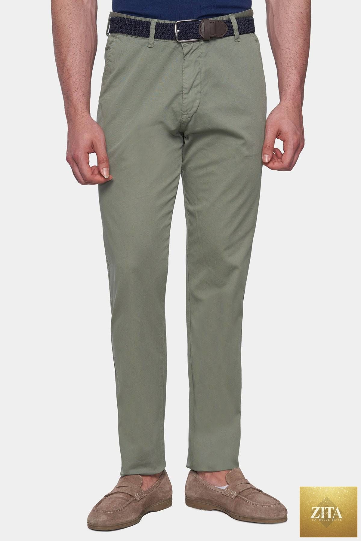 Olive green Bright Moons Timeless Chino pants displayed on a hanger, showcasing classic fit and durable fabric.