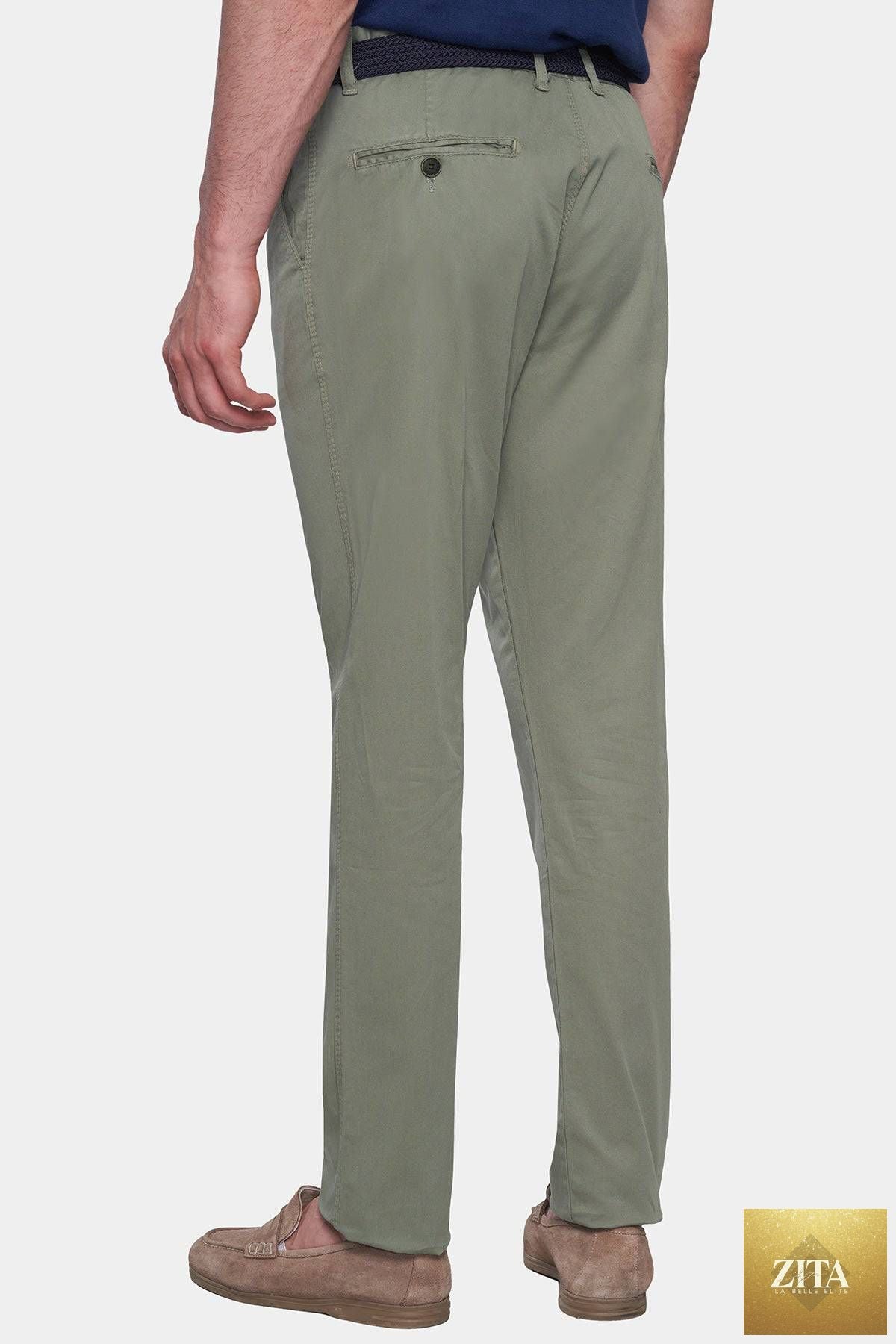 Olive Bright Moons Timeless Chino pants displayed on a hanger, showcasing the classic fit and fabric texture.