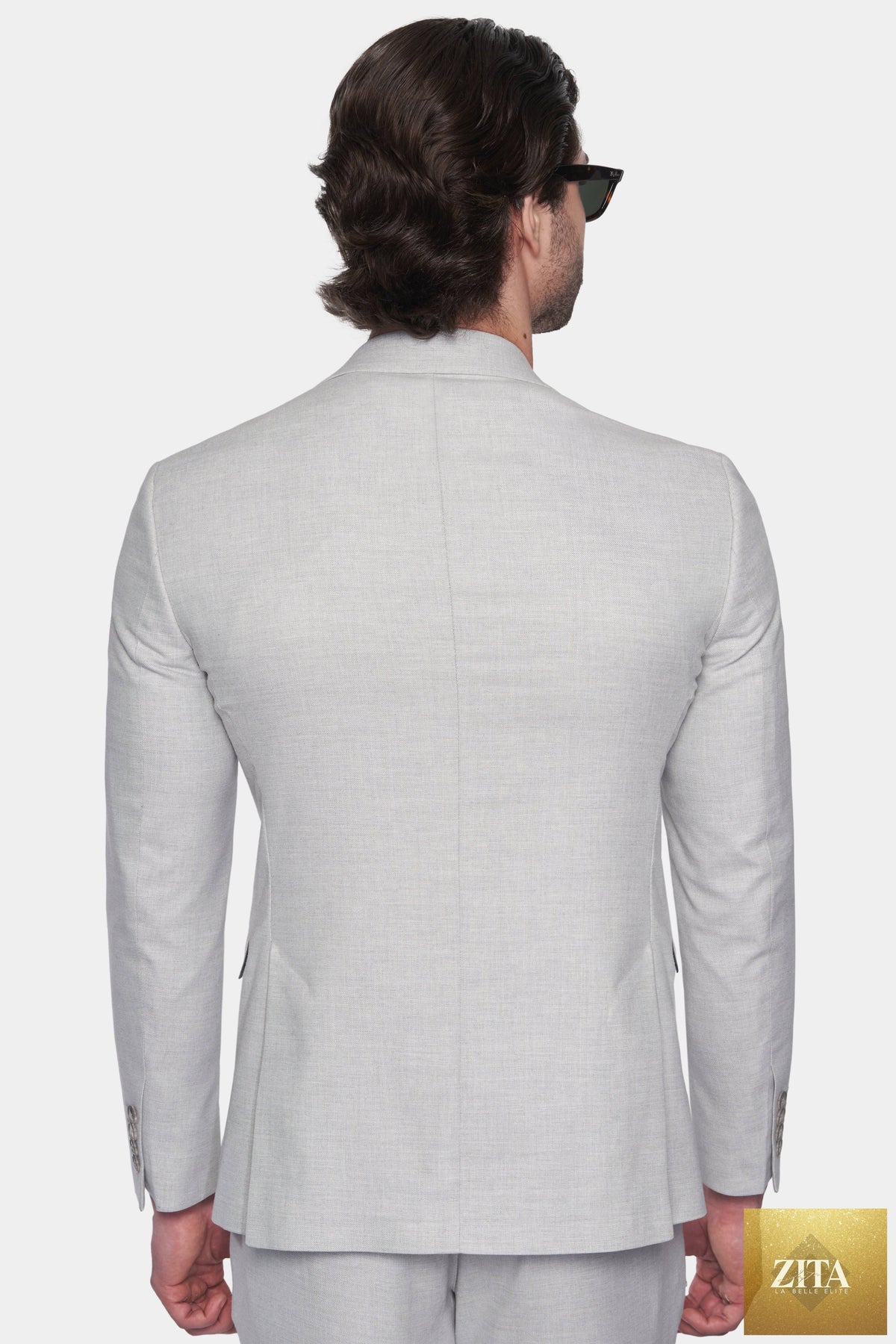 Tailored Bright Moons bespoke suit with seal pattern, featuring sharp lapels and classic fit, displayed on a mannequin.