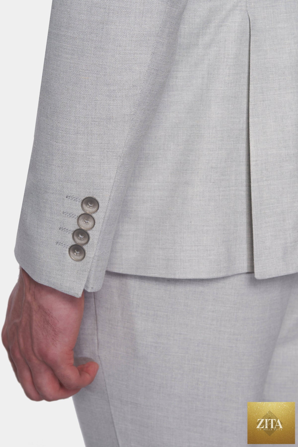 Elegant bespoke suit by Bright Moons featuring a tailored fit and classic design, showcased on a mannequin in the image.