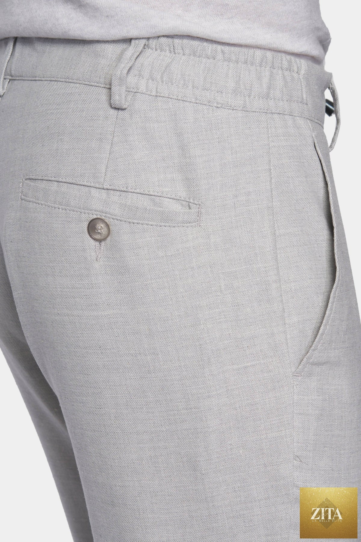 Close-up of a bespoke suit from Bright Moons, showcasing fine tailoring and detailed stitching on the Seal model.