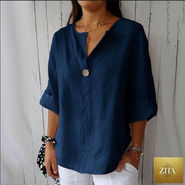 Women's V-neck long-sleeve button top by Zita La Belle Elite, loose fit casual blouse in soft fabric, shown hanging on a hanger.