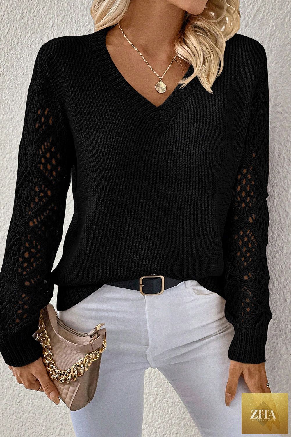 Black solid V-neck knit sweater with pointelle design, patchwork details, long sleeves, from Wild and Free Boutique.