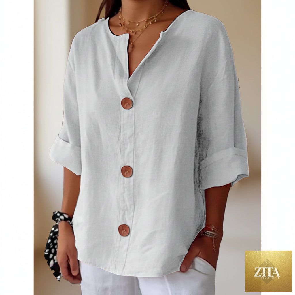 Women's V-neck cotton linen blouse with button details, casualwear by FitiqueFit, shown in a relaxed fit on a model.