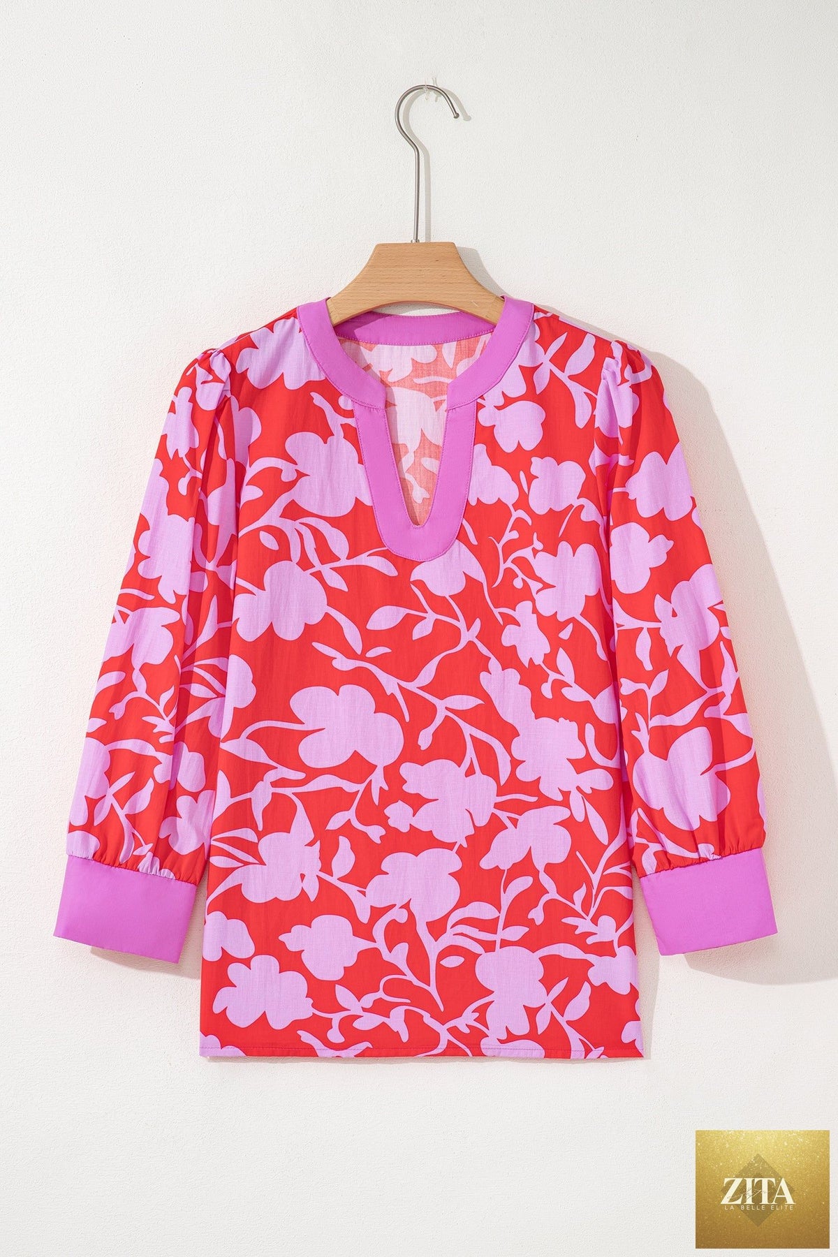 Red floral print blouse with split V-neck, cuffed bracelet sleeves, and relaxed fit from Wild and Free Boutique.