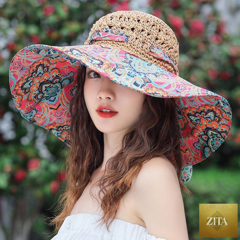 Women's patterned straw beach sun hat with a round crown from Zita La Belle Elite, offering UV protection for summer outdoor wear.