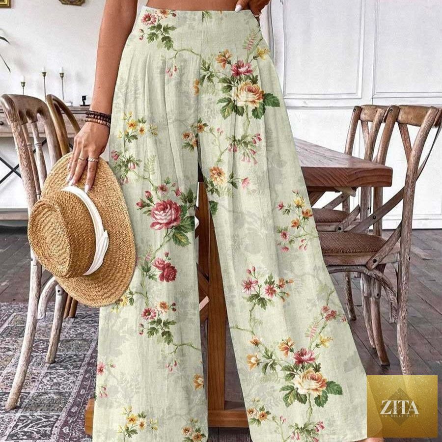 Plus-size women's denim wide-leg athletic pants with a casual fit, showcased on a model.