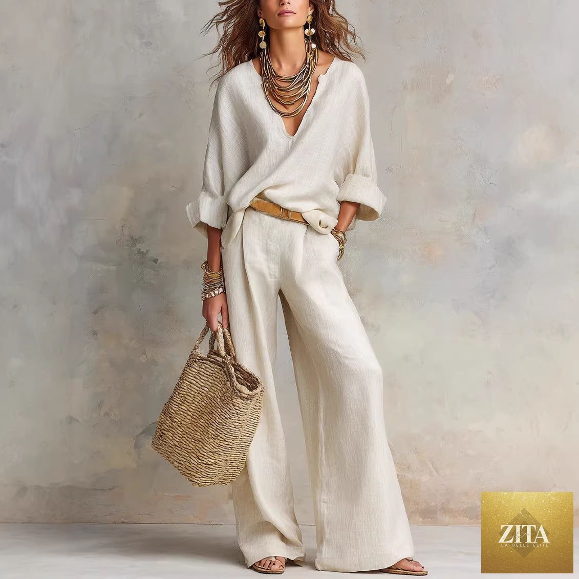 Women's casual linen vacation set by Zita La Belle Elite featuring a three-quarter sleeve top and full-length pants in neutral tones.