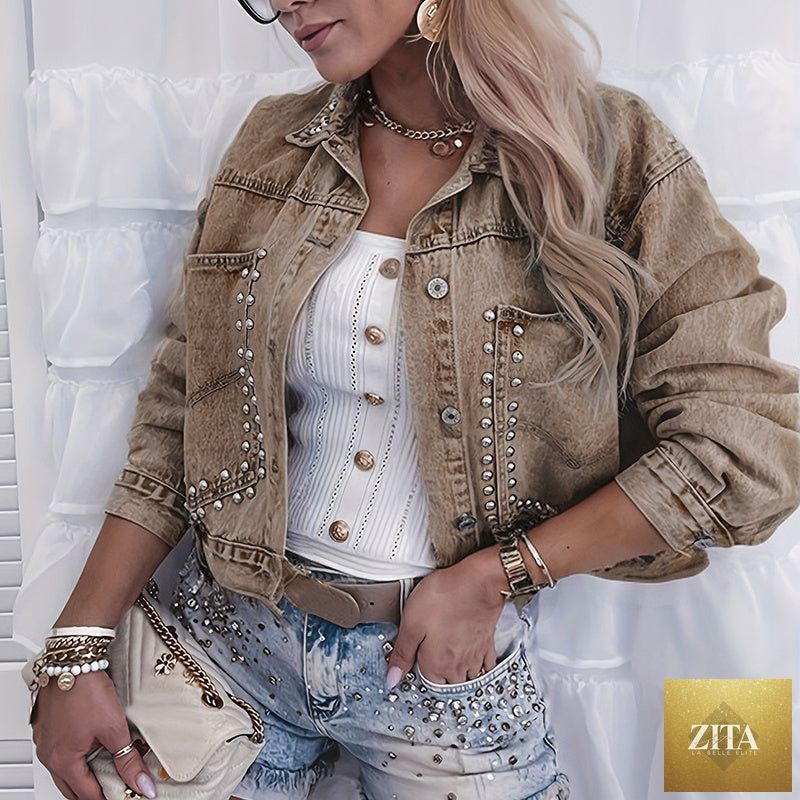 Women’s studded denim jacket by FitiqueFit featuring silver studs, classic blue denim, and a casual, trendy fit.