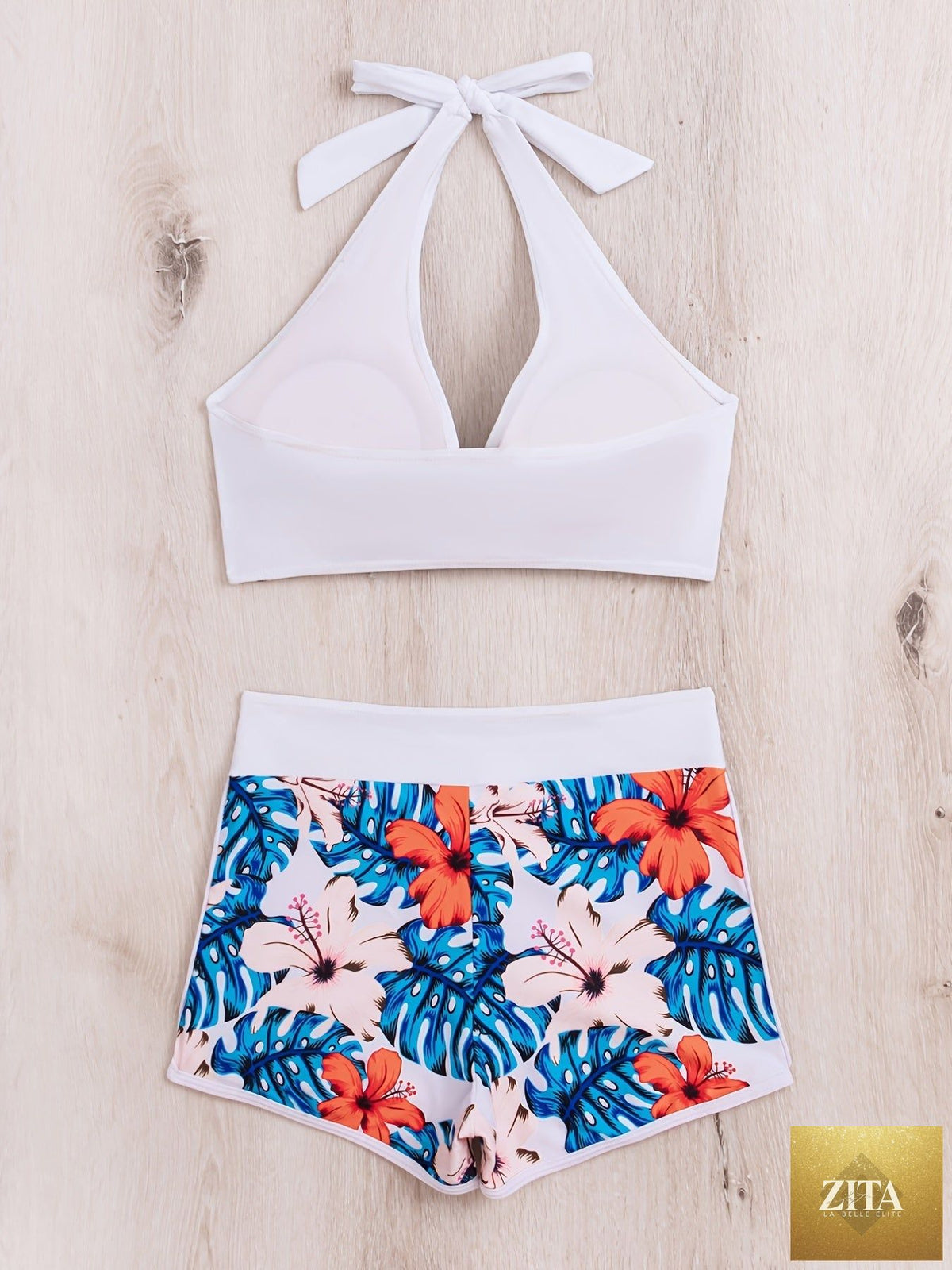 Stevvex floral halter neck bikini set with backless design, tie-neck bow, and high waist shorts for women’s summer beach swimwear.