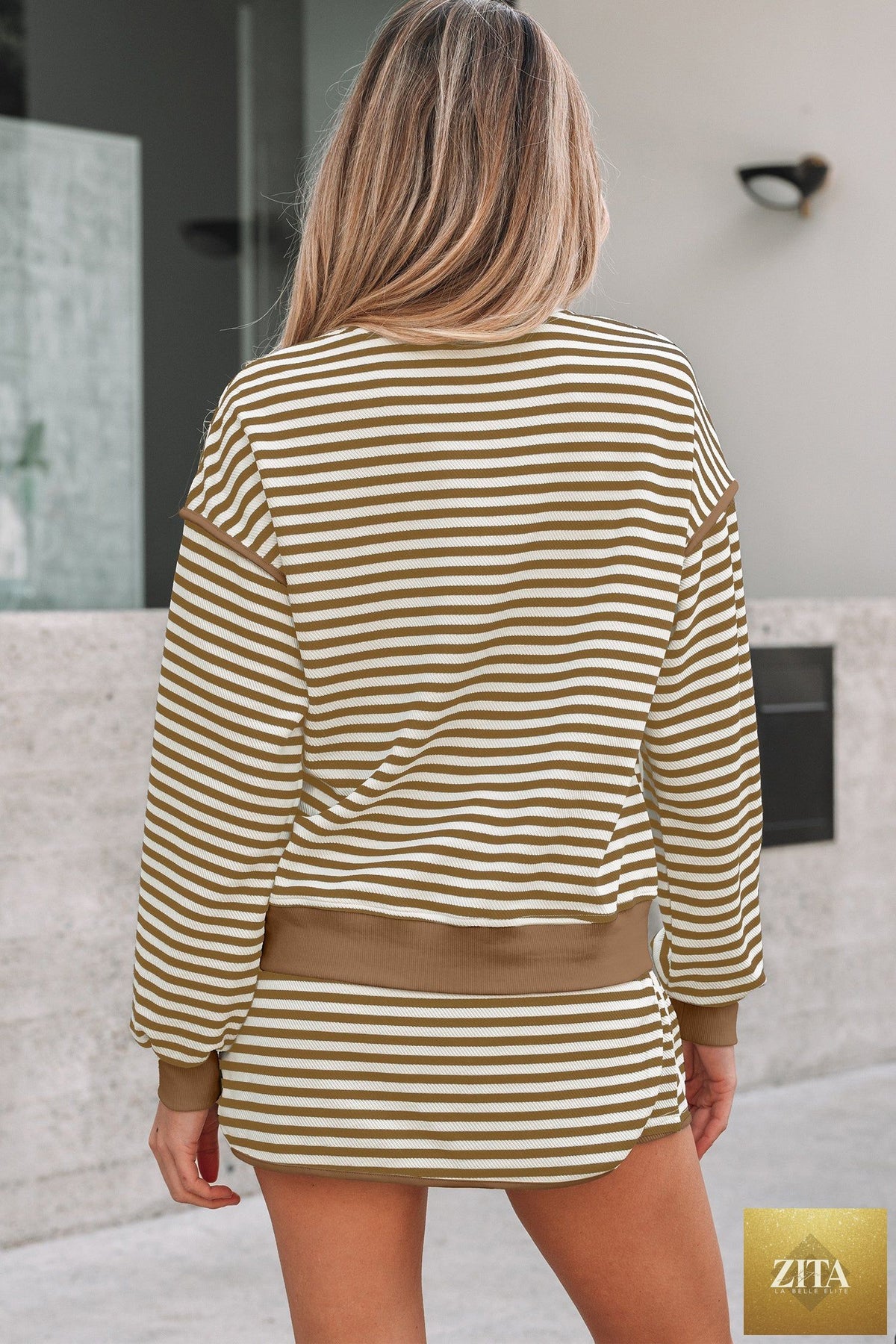 Black striped textured drop shoulder pullover top with drawstring mini skirt, part of Wild and Free Boutique two-piece dress set.