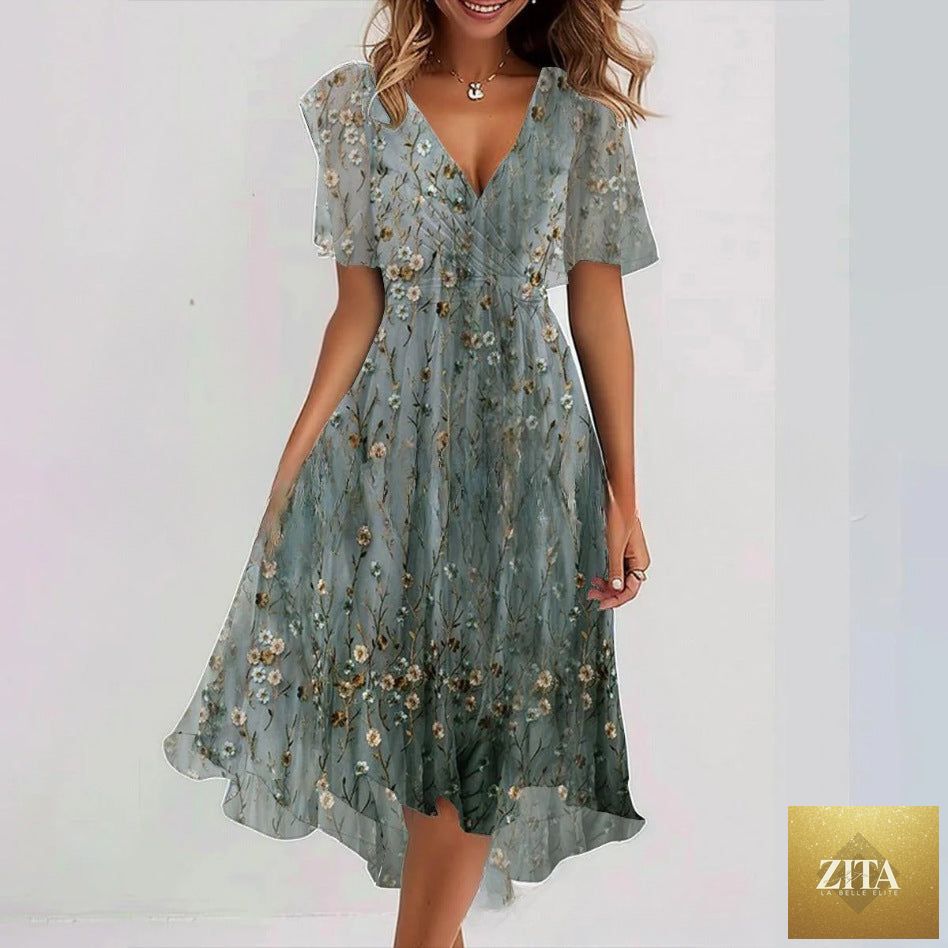 Floral print FitiqueFit A-line dress with V-neck, short sleeves, and midi length, showcasing a vibrant floral pattern on lightweight fabric.