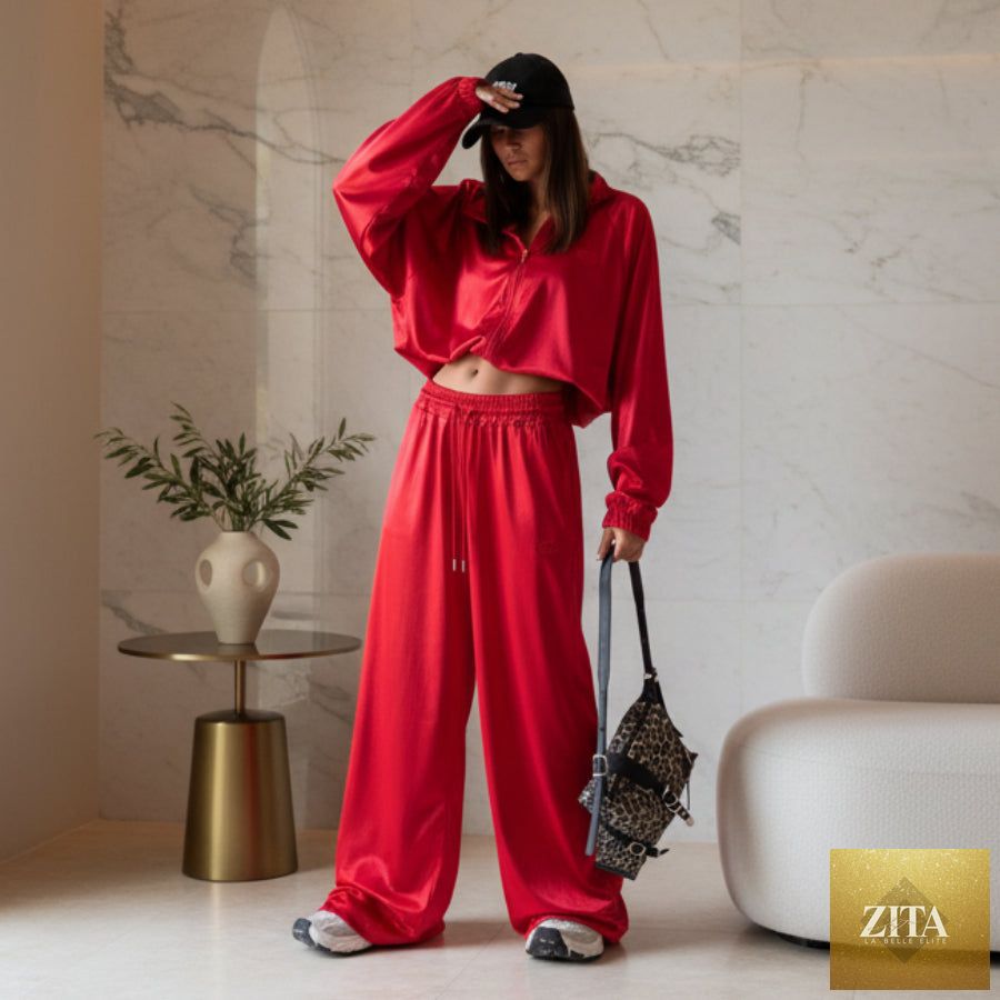 Satin wide-leg two-piece set by MERIDGE featuring a stylish top and matching flowing pants in smooth satin fabric.
