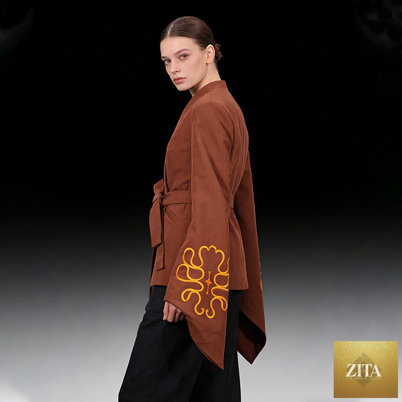 Elegant women's slim-fit blazer with embroidered details and flared sleeves, showcasing high-end sophistication and stylish design.