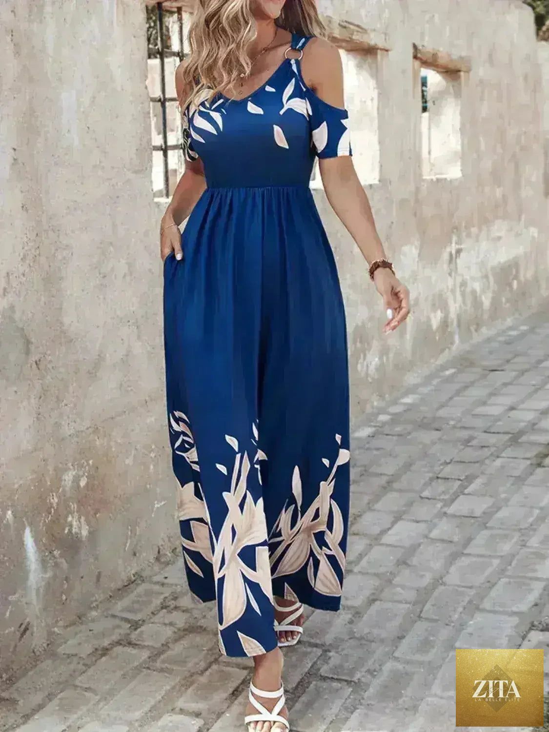 Printed cold shoulder maxi dress for women by Femstylo, stylish polyester fabric, flowing design, and feminine silhouette.