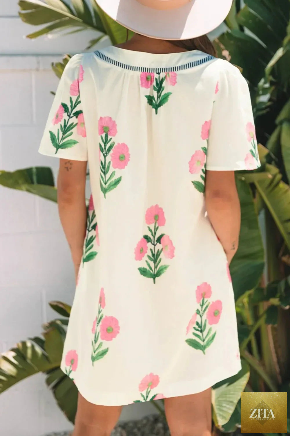 Floral print flutter sleeve summer mini dress by Shopiebay, featuring a lightweight fabric and a feminine, flowy silhouette.