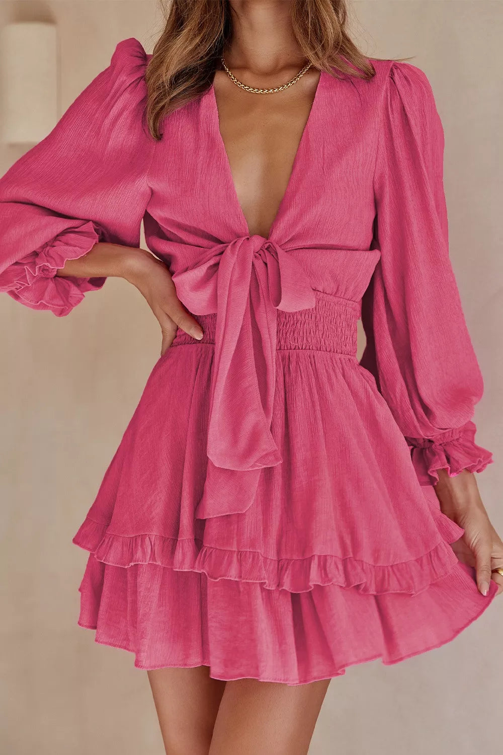 Elegant tie-front ruffle mini dress with smocked waist by Shopiebay, featuring a stylish design and feminine details.