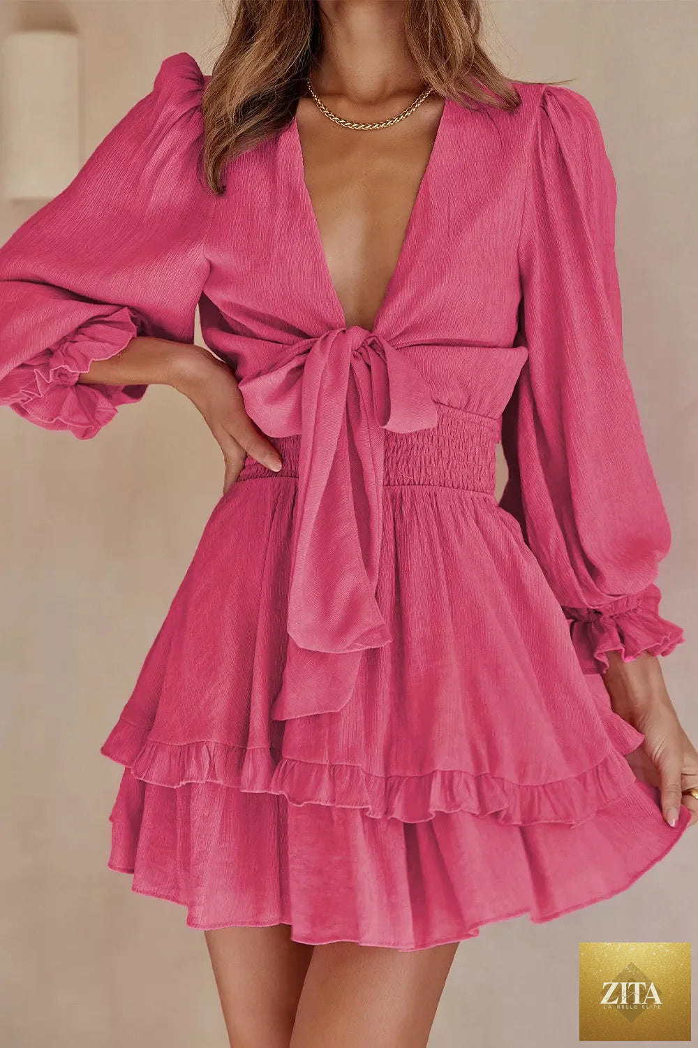 Elegant tie-front ruffle mini dress with smocked waist by Shopiebay, featuring a stylish design and feminine details.