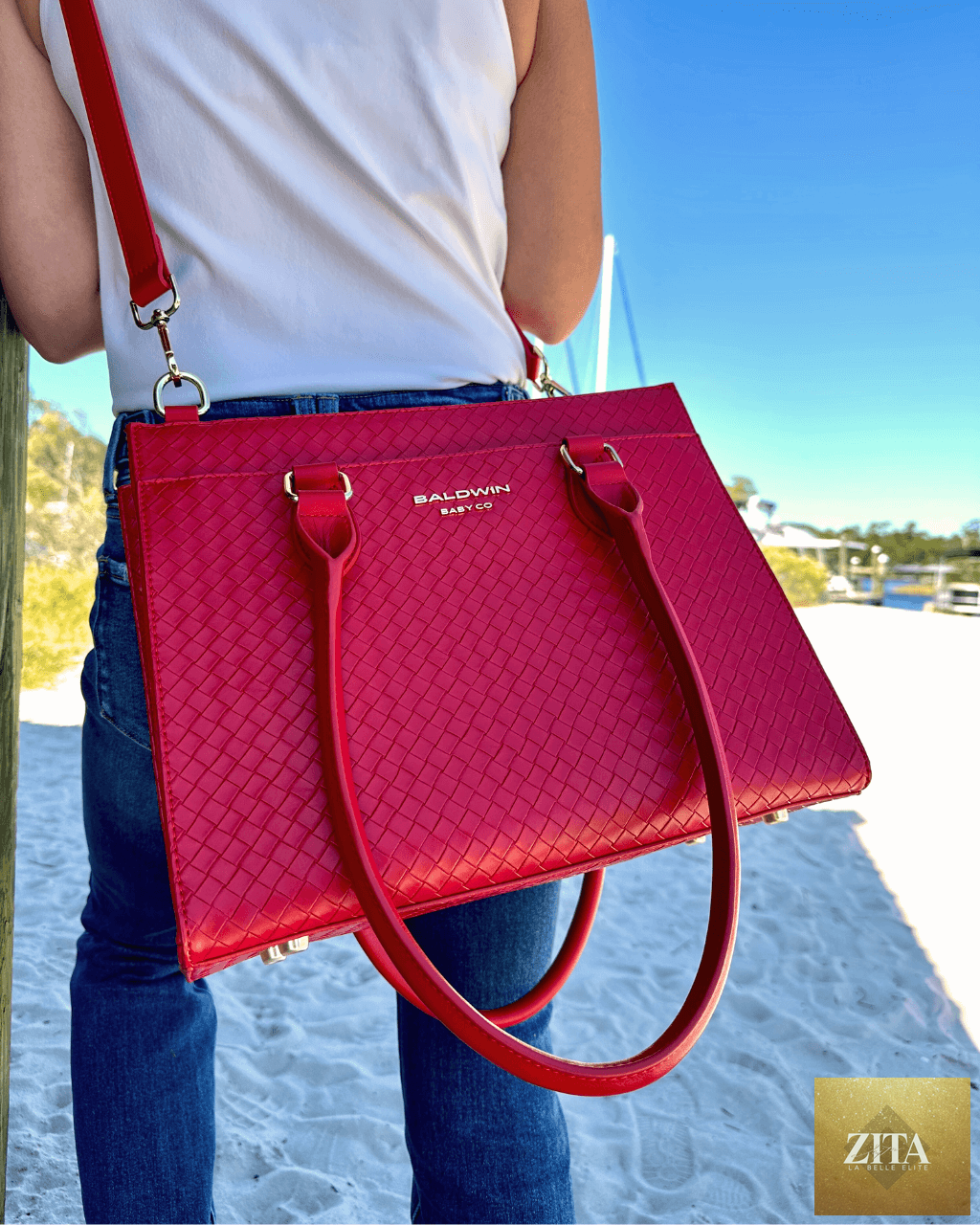 Baldwin Baby Company Montrose Diaper Bag Tote in vibrant cardinal red with multiple compartments and stylish design.