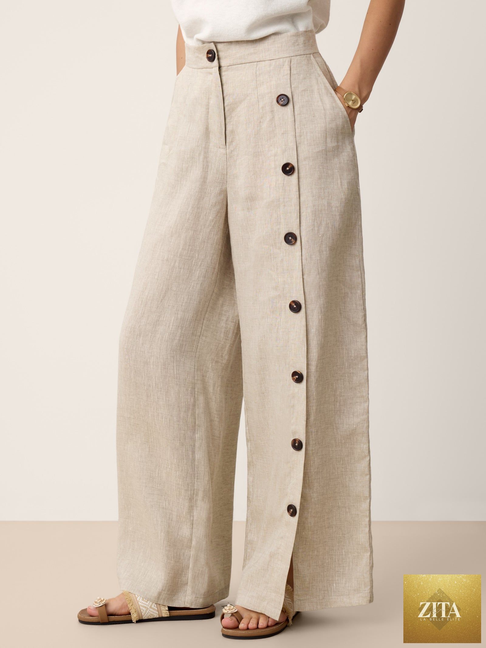 LINTICO Katya 100% linen buttoned slit-hem pants in stone oat color, shown with relaxed fit and front button details.