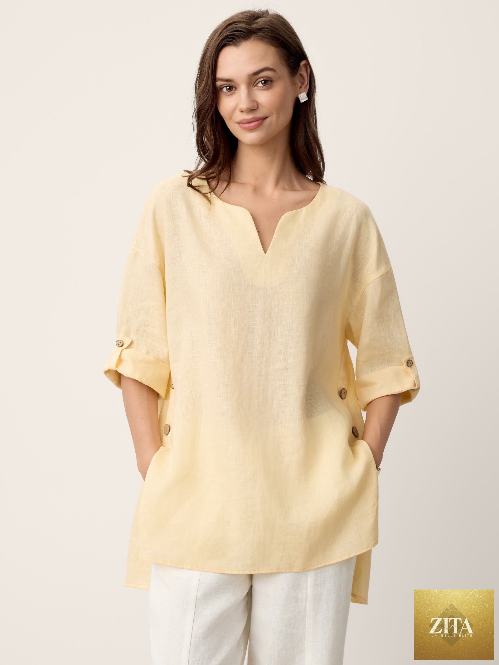 LINTICO Daphnea 100% linen oversized curved-hem top in soft butter color, relaxed fit, lightweight and breathable linen fabric.