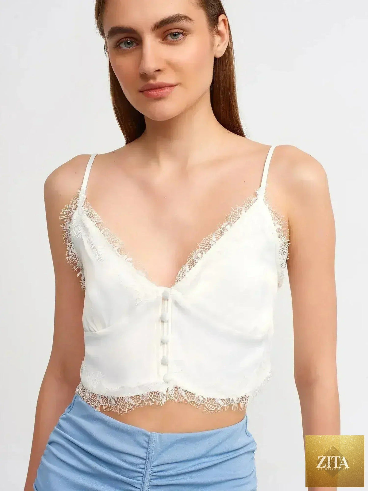 Femstylo lace detail crop top made of rayon-viscose blend, featuring feminine style and intricate lace accents.