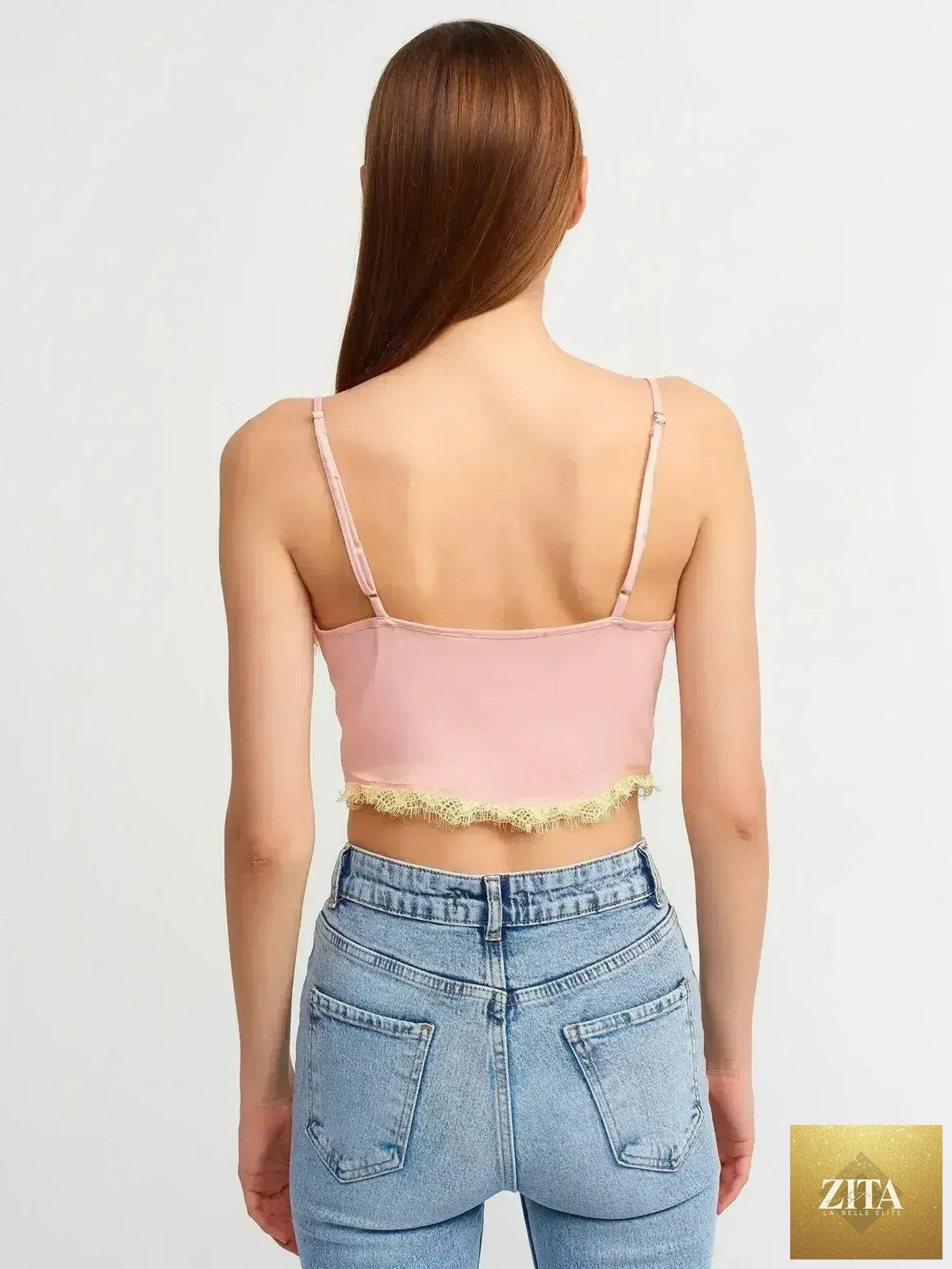 Pink lace detail crop top by Femstylo featuring a feminine style, rayon-viscose blend fabric, and a trendy cropped silhouette.