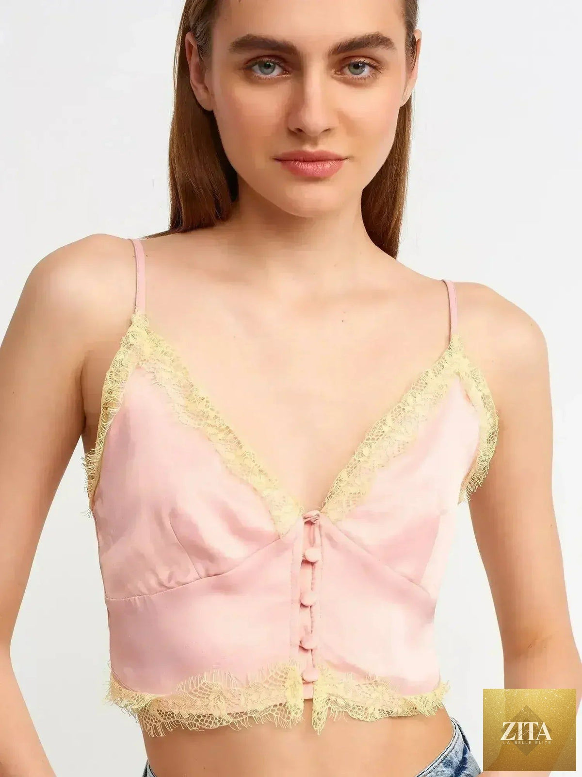 Pink lace detail crop top by Femstylo featuring a rayon-viscose blend and feminine style, shown on a model.