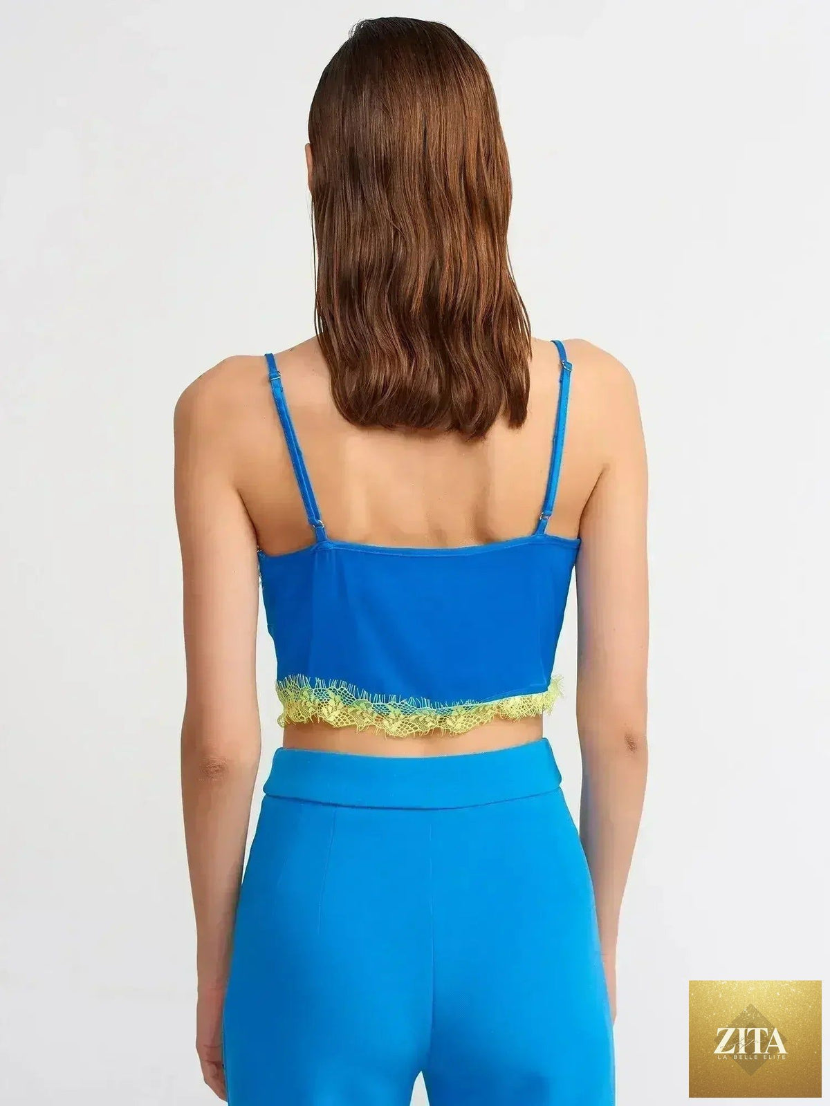 Femstylo lace detail crop top made of rayon-viscose blend, featuring feminine style and intricate lace accents.