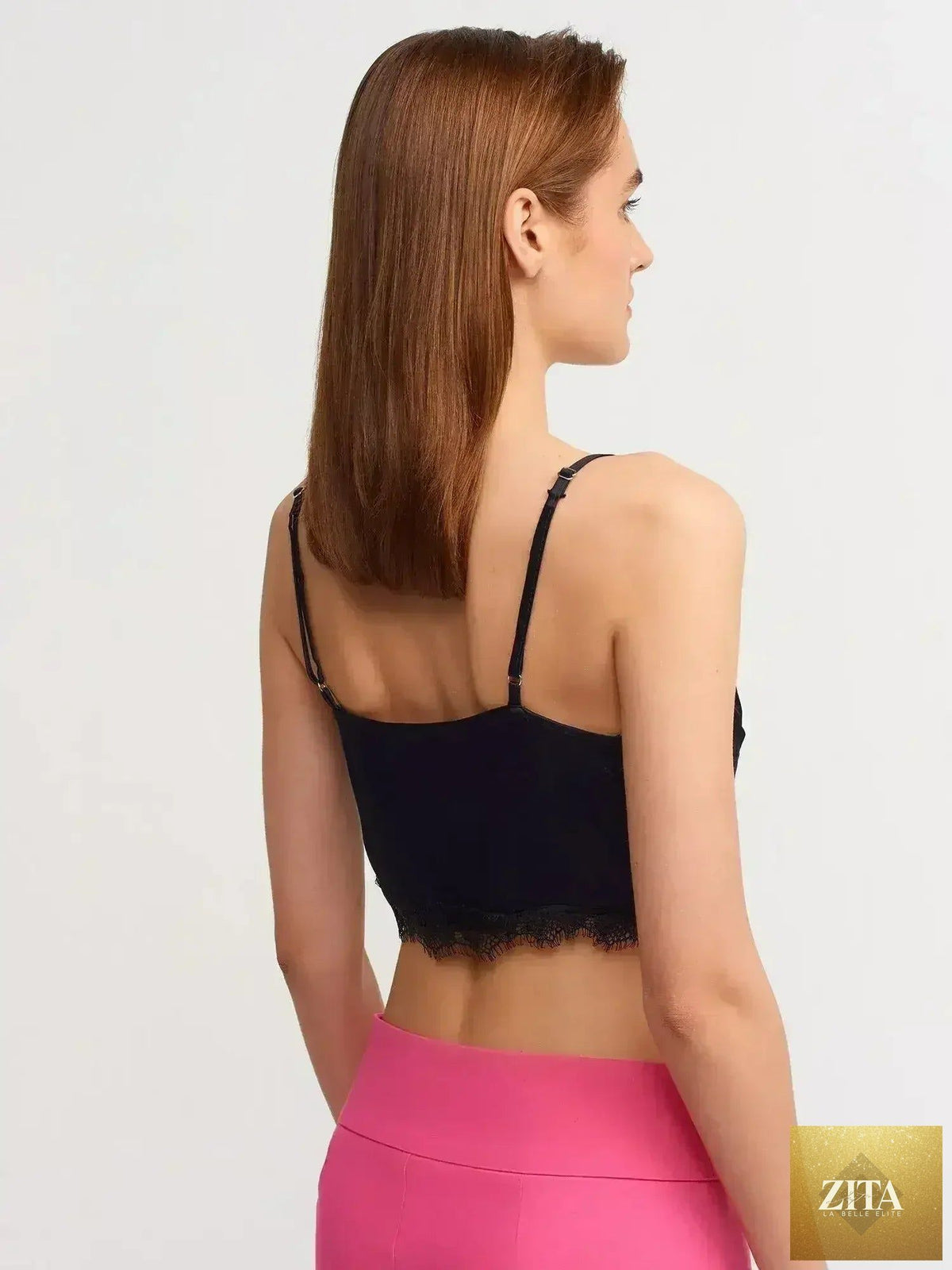 Black lace detail crop top by Femstylo featuring a feminine style and rayon-viscose blend fabric.