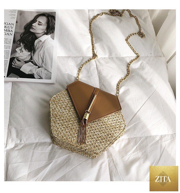 Elegant genuine leather handbag by Stevvex featuring a woven straw and leather design, perfect for summer beach and casual outings.